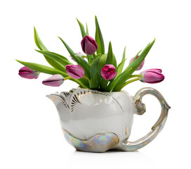Bouquet  lilac tulips in vintage ceramic pot on a white background