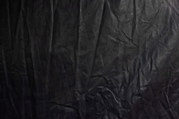 Wrinkles on rubber blanket for covering things on trucks. Abstract background.