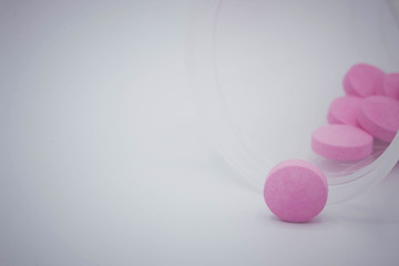 pink pills on white background with copy space for add text.