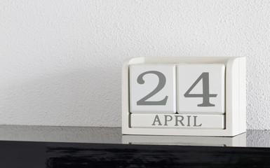 White block calendar present date 24 and month April
