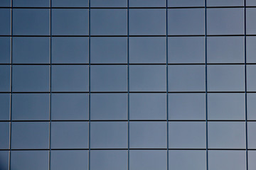 Facing panels of modern building wall.