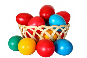 Fototapeta na wymiar Isolated Easter eggs in different colors in a wooden basket