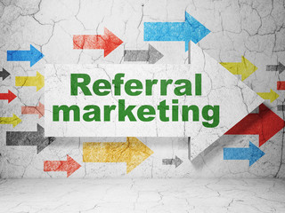 Advertising concept:  arrow with Referral Marketing on grunge textured concrete wall background, 3D rendering