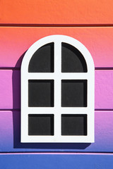 small windows arch toy on colorful gradient lines wood texture background