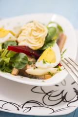 Potato salad with red beet, smoked herring, egg and soy-bean mayonnaise