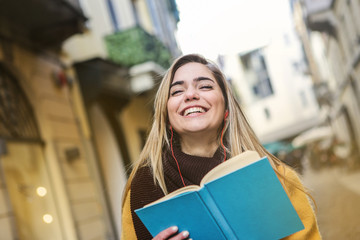 Smiling girl holding a book