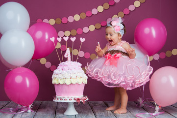 The little girl's birthday girl was smeared into a cake. The first cake. The use of the first cake....