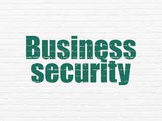 Safety concept: Painted green text Business Security on White Brick wall background
