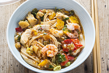 Spicy chicken & king prawn with wholewheat noodles. Strips of cooked chicken breast and king prawn with wholewheat noodles coated in chilli, lime and coriander sauce with vegetables. 