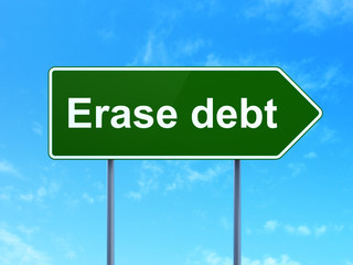 Finance concept: Erase Debt on green road highway sign, clear blue sky background, 3D rendering