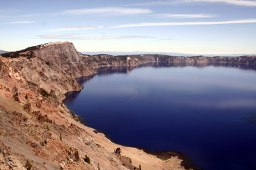 Fototapeta na wymiar A view of the blue water of Crater Lake in the Crater Lake National Park in a sunny day, Oregon, USA