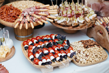 Table with food, tapas bar with spanish cuisine, cured meat, cheese and platter with other appetizers from spain, top view
