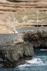 Cliff along the promenade in Porto da Cruz on Madeira. Portugal