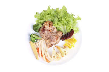 Chicken steak and grilled mixed vegetables .