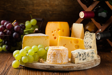 Mix cheese on wooden board.