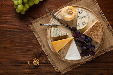 Mix cheese on wooden board.