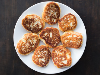 cheese cakes lie on a white plate