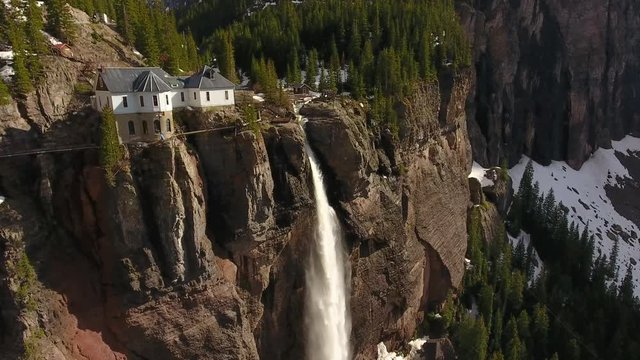Orbiting House Perched on Gigantic Waterfall in Telluride Colorado
