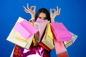 Shopping, gesture, fashion, young woman with shopping bags