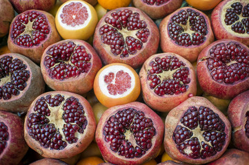 Sliced Pomegranates And Oranges