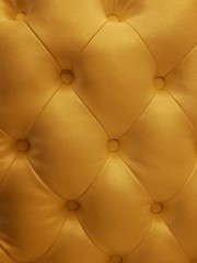 gold leather sofa texture background.