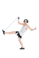 Skinny sportsman in eyeglasses with jump rope and bottle of water isolated on white