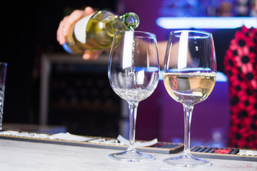 An white wine is pours