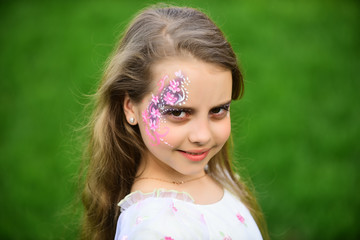 Girl child with fashionable art makeup, spring.