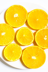 Slices of orange isolated on white background. top view;