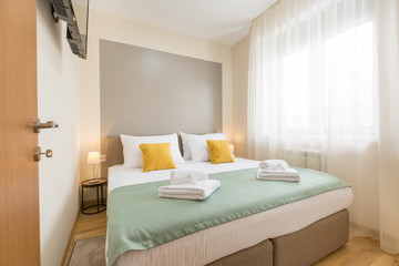 Naklejka premium Interior of a hotel bedroom with double bed