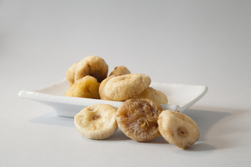 dryed figs on white isolated background