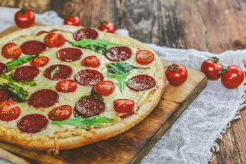 Tasty Pizza With Tomato Sauce, Pepperoni Sausage, And Mushrooms On Wooden Background Natural Rustic, A Pizza Cutter And Ingridienty.