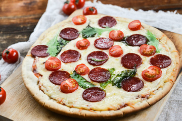 Tasty Pizza With Tomato Sauce, Pepperoni Sausage, And Mushrooms On Wooden Background Natural Rustic, A Pizza Cutter And Ingridienty.