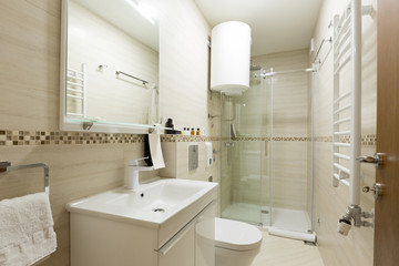 Interior of a hotel bathroom with shower cabin