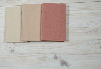 Pile of old books pastel colors stacked. Selective focus with copy space