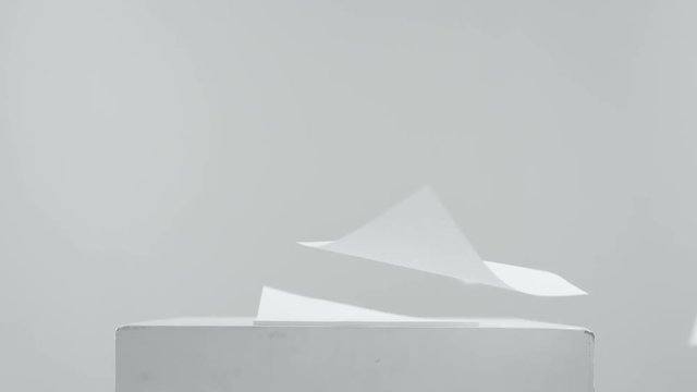 Blank paper sheets falling down