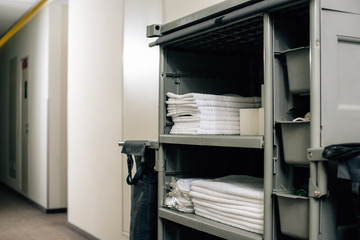 housekeeping cart with clean towels at hotel