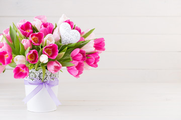 Pink tulip on the white background. Easter background