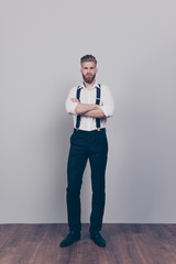 Vertical full-length full-size portrait of brutal handsome strict proud harsh authoritative bossy serious man standing with crossed arms wearing formal clothes outfit isolated on gray background