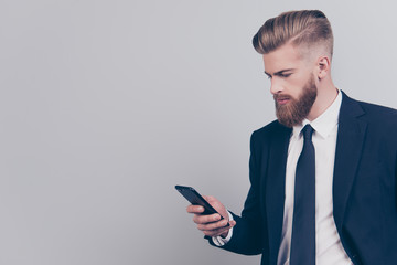 Leadership people contact links concept. Profile side view half-faced portrait of serious handsome clever managing busy official financier banker checking post getting sms isolated on gray background