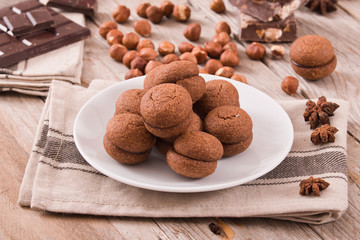 Hazelnut shortbread sandwiches filled with chocolate cream.