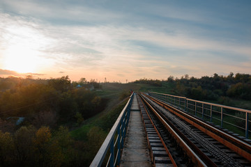 Fototapeta na wymiar Landscape of sunset and railroad in village. Moldova 2017.