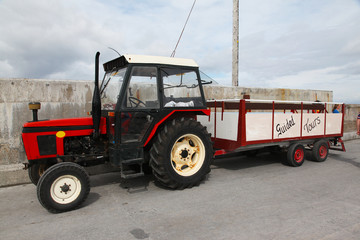 Fototapeta premium Guided tours on the red tractor on Inisheer