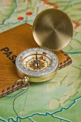 compass and passport on the map