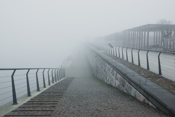 Obraz premium Boulevard on the Vistula river at foggy morning in Warsaw, Poland