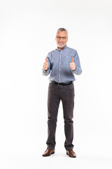 Fototapeta premium Happy mature man smiling and showing thumbs up