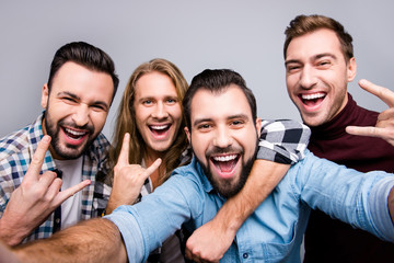 Ethnicity diversity masculinity socialization lifestyle leisure laughter winner entertainment concept. Close up photo of cheerful candid boys pals taking selfie isolated on gray background