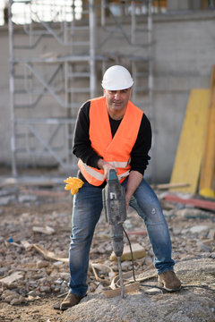 Male Construction Worker Using Jackhammer