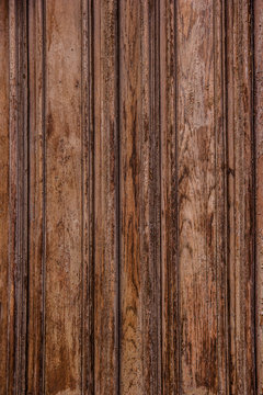 Brown wooden texture. Old planks with peeling paint.