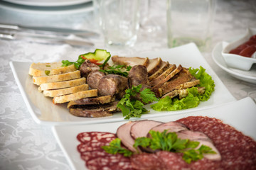 catering table set service with silverware and glass stemware at restaurant before party